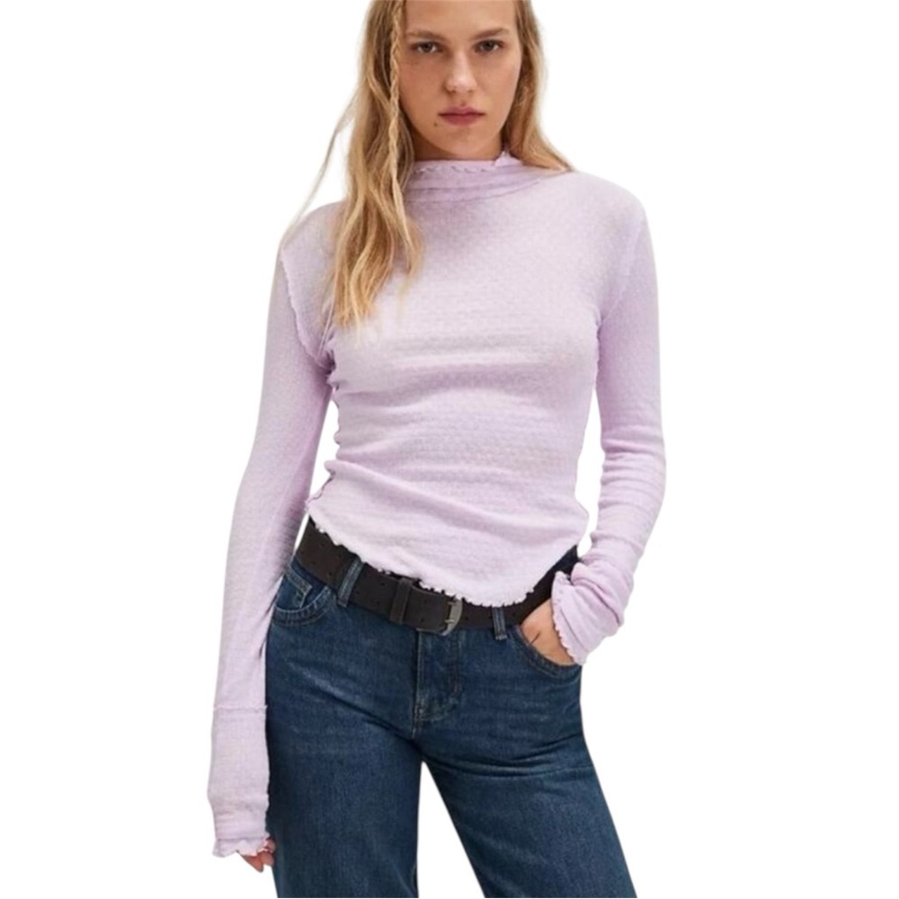 Free People We The Free Sara Pointelle Turtleneck in a lilac/orchid color